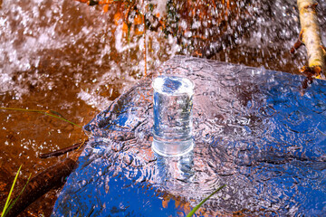 Measuring cup filled to top with clean water from natural underground source. Drinking water...