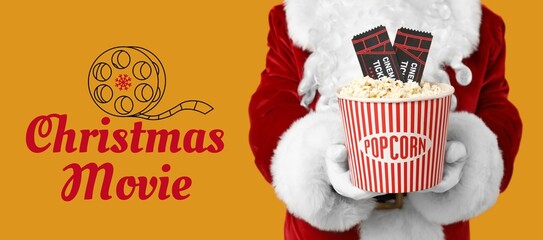 Santa Claus with cinema tickets and bucket of popcorn on yellow background. Christmas movie concept