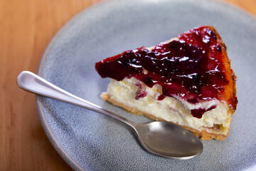 Popular American dessert cheesecake with crunchy bottom and creamy main layer, topped with berries
