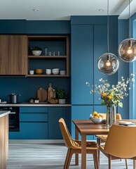 Modern Scandinavian Kitchen and Dining Area with Blue Accents, Wooden Furniture and Elegant Lighting Fixtures, Featuring Minimalist Decor and Indoor Plants.