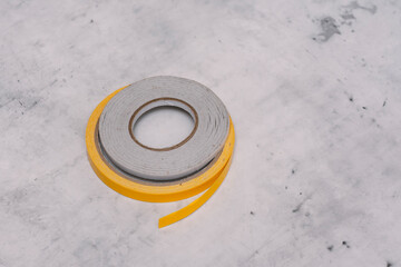 Double-sided adhesive tape for home, office, and craft projects.