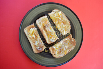 Toasted wholemeal bread with butter and English marmalade.