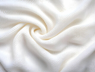 Soft, textured white fabric elegantly draped, perfect for backgrounds and fashion designs.