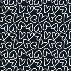 Seamless pattern with abstract white hearts on black background.