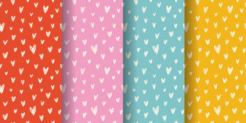 Set of seamless patterns with doodled hearts. Cream-white hearts on red, pink, blue, and yellow backgrounds. Ideal for Valentine's Day projects, wrapping paper, or textiles.