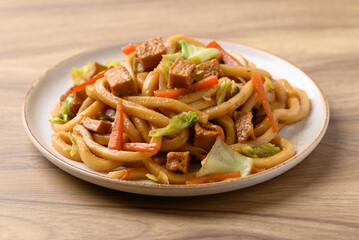 Yaki Udon, Stir fried udon noodles with tofu, carrot, cabbage and mushroom, Japanese cuisine, Asian...