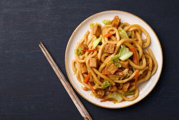 Yaki Udon, Stir fried udon noodles with tofu, carrot, cabbage and mushroom, Japanese cuisine, Asian vegetarian food