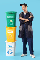Male scavenger with trash bins on blue background