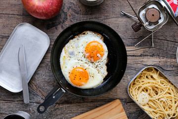 Fried Eggs at Camp on Wooden Table