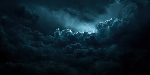 Fototapeta premium Dramatic Dark Clouds with High Contrast Lighting in a Cinematic Atmosphere Capturing an Intense and Mysterious Sky View at Night