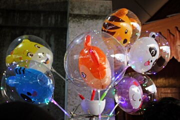 clear balloons with animal character balloons inside