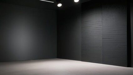 Empty studio room with dark wall lighted by minimalist lamp
