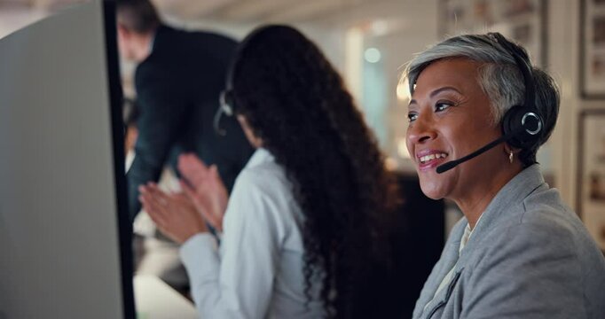 Happy, call center and mature woman on computer for customer service, technical support or contact us. Smile, consultant and talking at help desk for solution, advice and overtime at night in office