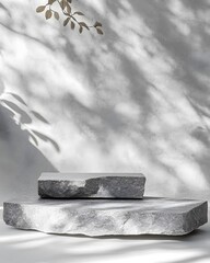 Two textured stone slabs on a light background with soft shadows.