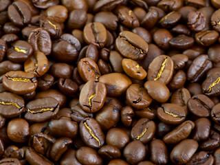 Fototapeta premium coffee beans on the table, close up view