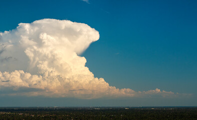 Florida weather. Blue sky with white summer rain clouds. Colorful summer landscape