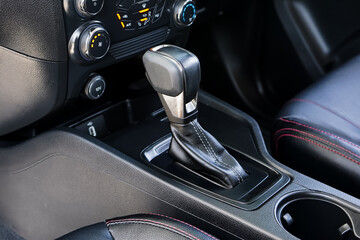 automatic transmission shift selector in the car interior. Closeup a manual shift of modern car...