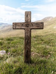 Weathered wooden cross in grassy field