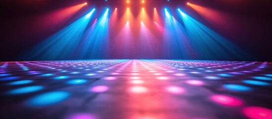Vibrant Neon Dance Floor Illuminated by Colorful Stage Lights with Blue and Pink Beam Effects