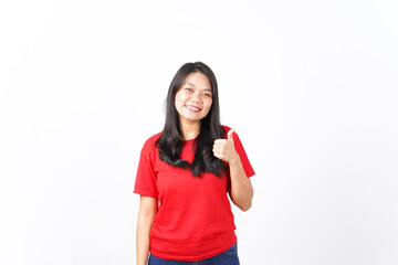 Smiling Looking at camera and showing thumbs up Of Beautiful Asian Woman wearing red shirt Isolated On White Background