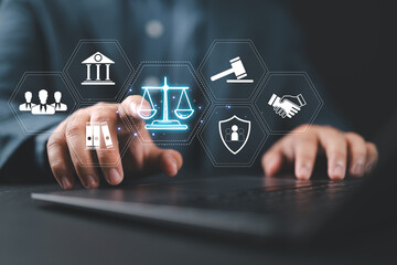 Legal Professional with Justice Icons. A suited legal professional touches virtual icons...