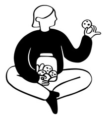 Woman sitting with cookie jar and holding cookie in hand