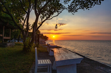 Table and chair at the seashore, Bali, Indonesia, Southeast Asia.