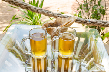 Table with two glasses ofbeer, Labuan Bajo, Ost Nusa Tenggara, Flores, Indonesia, Southeast Asia.