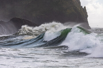Massive King Tides surge and crash against the rugged shores of Cape Disappointment, Washington, capturing the raw power and untamed beauty of the Pacific Ocean in a dramatic display of nature