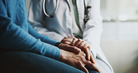 Holding hands, doctor and patient with comfort, compassion and advice with results in clinic....