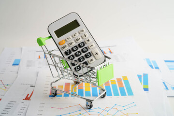 Online shopping, Shopping cart box on calculator, import export, finance commerce.