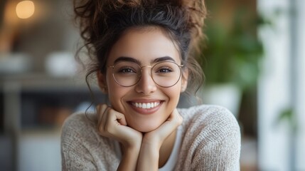 Joyful businesswoman with a laptop, white office backdrop, soft-focus background of teamwork, bright and airy, collaborative feel.
