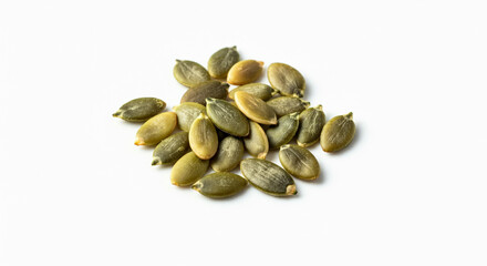 A heap of pumpkin seeds piled together on a bright white background, showing their oval shape and natural texture