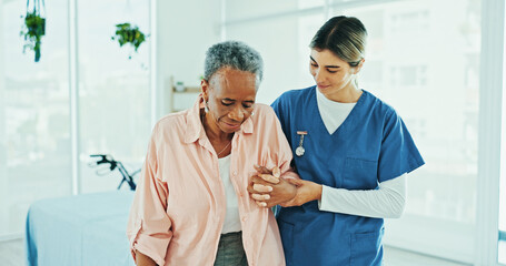 Physiotherapist, helping and senior care for old woman, clinic and walking for rehabilitation and...
