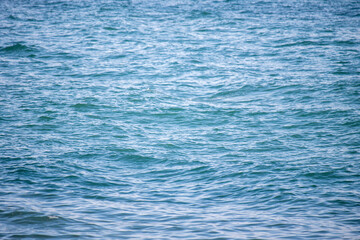 background of blue sea water in sunny weather nature.