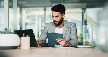Businessman, tablet and laptop for connection, bookkeeping and research in financial agency. Male...