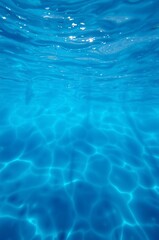 Fototapeta premium Crystal Clear Underwater Surface with Light Reflections and Gentle Waves