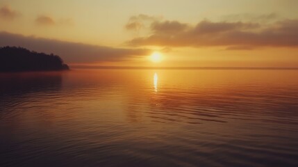 Fototapeta premium Serene Baltic Sea Sunrise with Tranquil Waters and Warm Orange Sky Reflecting on Calm Surface