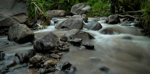 Beautiful silky water at riverside. Slow speed photo shot. Tropical countryside