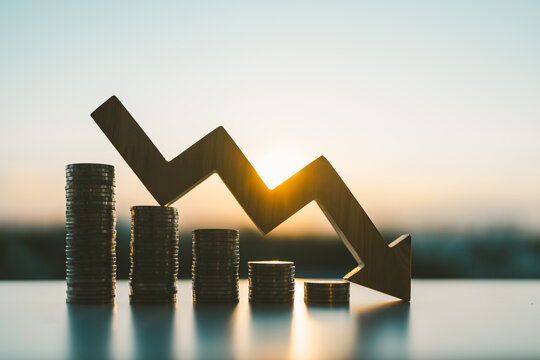 Down arrow with coin stack. concepts for success, methods, systems of raising or lowering Fed interest rates to correct inflation concepts.