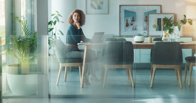 Laptop, decision and businesswoman in office for project proposal at creative startup company. Ideas, thinking and female copywriter with computer for multimedia journalism in boardroom at workplace.