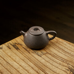 An Elegant Teapot Displayed Beautifully on a Wooden Table Surface, Perfect for Any Setting
