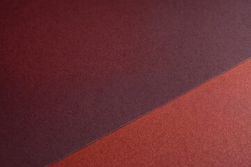 Fototapeta premium maroon colorful gradient background. Full framed close up flat lay uniform cardboard texture.
