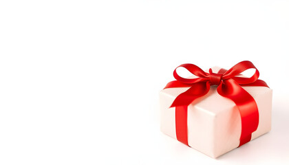 Obraz premium Festively Wrapped Christmas Gift Box Adorned with Red Bow and White Background