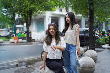 Fototapeta premium two asian women on the street