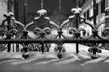 Closeup of ancient forged fence in snow