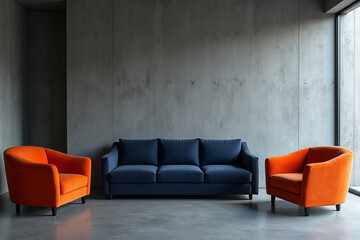A sleek and modern living room scene: a stark concrete wall provides a dramatic backdrop for a minimalist design. Two vibrant orange armchairs sit harmoniously alongside a dark blue sofa, their bold c