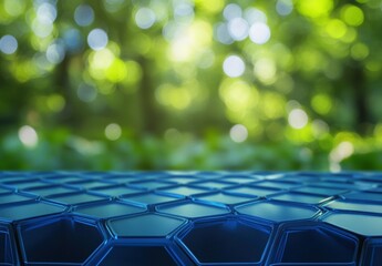 Obraz premium Blue Hexagonal Pattern Surface with Green Nature Background Blur