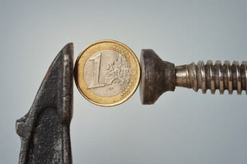 Iron vise tool with euro coin - Concept of stress test and financial pressure