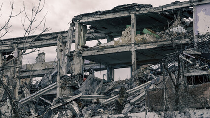 destroyed and burned factory buildings in the city in Ukraine